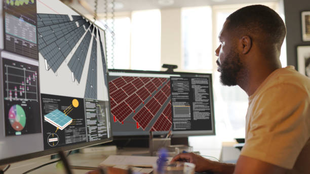 <span  class="uc_style_uc_tiles_grid_image_elementor_uc_items_attribute_title" style="color:#ffffff;">Close up stock image of an African American man working at a computer screen. He?s working on CAD software looking at the design of a solar panel array in CAD with data.</span>