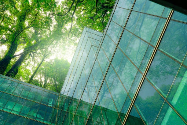 <span  class="uc_style_uc_tiles_grid_image_elementor_uc_items_attribute_title" style="color:#ffffff;">Eco-friendly building in modern city. Sustainable glass office building with trees for reducing CO2. Green architecture. Building with green environment. Sustainability corporate. Net zero emissions.</span>